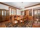 Formal dining room with wood trim, a chandelier, and elegant furniture at 1816 Country Garden Dr, Shelby, NC 28150