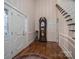 Elegant foyer with hardwood floors, a grandfather clock, and a grand staircase at 1816 Country Garden Dr, Shelby, NC 28150