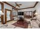 Inviting living room with a ceiling fan, fireplace, and an opening to the dining room, perfect for entertaining guests at 1816 Country Garden Dr, Shelby, NC 28150