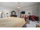 Inviting main bedroom features elegant furniture, ceiling fan, dresser, and an opening to the main bathroom at 1816 Country Garden Dr, Shelby, NC 28150