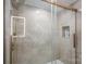Modern walk-in shower featuring bronze hardware, rainfall showerhead, and tiled walls with built-in niche for toiletries at 1816 Country Garden Dr, Shelby, NC 28150