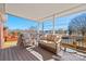 Inviting covered deck furnished with comfortable seating, perfect for enjoying the outdoors at 1911 Connemara Ct, Gastonia, NC 28054