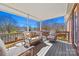 Covered deck with comfortable seating, perfect for relaxing and enjoying the outdoors at 1911 Connemara Ct, Gastonia, NC 28054