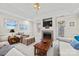 Cozy living room features a fireplace, comfortable seating, and natural light at 1911 Connemara Ct, Gastonia, NC 28054