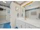 Bright bathroom with a white vanity, large mirror, and shower at 1911 Connemara Ct, Gastonia, NC 28054
