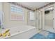 Luxurious bathroom featuring a jetted tub and a glass-enclosed shower at 1911 Connemara Ct, Gastonia, NC 28054