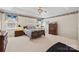 Spacious primary bedroom with floral accents and plush carpeting at 1911 Connemara Ct, Gastonia, NC 28054