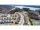 Aerial view of new construction homes in a neighborhood near a lake and surrounded by trees at 19113 Hawk Haven Ln, Charlotte, NC 28278