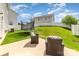 Backyard featuring a trampoline, patio seating, grassy area, and a white fence at 19113 Hawk Haven Ln, Charlotte, NC 28278