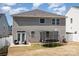 Backyard view with trampoline, patio seating, white fence and two story home at 19113 Hawk Haven Ln, Charlotte, NC 28278