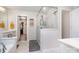 Bright bathroom featuring a large glass shower, white marble floors, and walk-in closet at 19113 Hawk Haven Ln, Charlotte, NC 28278