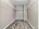 This walk-in closet features metal shelving for optimal organization at 19113 Hawk Haven Ln, Charlotte, NC 28278