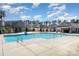 Community pool with clear blue water, pool house, and lounge area for relaxing at 19113 Hawk Haven Ln, Charlotte, NC 28278