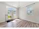 Dining room with french doors leading to outside, wood floors, and a view of the backyard at 19113 Hawk Haven Ln, Charlotte, NC 28278