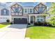 Charming two-story home featuring a well-maintained lawn, a two-car garage, and stone accents at 19113 Hawk Haven Ln, Charlotte, NC 28278