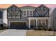 Charming two-story home with neutral siding, black trim, covered porch, and a well-maintained lawn at 19113 Hawk Haven Ln, Charlotte, NC 28278