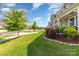 A view from the front yard of a landscaped lawn, neighborhood street, and well-maintained homes at 19113 Hawk Haven Ln, Charlotte, NC 28278