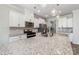 Spacious kitchen featuring granite countertops, stainless steel appliances, and ample white cabinet space at 19113 Hawk Haven Ln, Charlotte, NC 28278