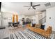 Inviting open-concept living room and dining area with hardwood floors, modern lighting, and stylish furniture at 19113 Hawk Haven Ln, Charlotte, NC 28278