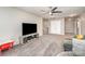 Living room with a ceiling fan, TV, and seating at 19113 Hawk Haven Ln, Charlotte, NC 28278