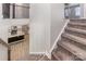 Carpeted staircase leading upstairs, adjacent to an open kitchen area at 19113 Hawk Haven Ln, Charlotte, NC 28278