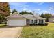 Charming single-story home features a two-car garage and well-maintained landscaping at 2018 Arlington Ave, Statesville, NC 28677