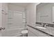 Bathroom boasts granite countertops, a white sink, and a tub with shower at 2101 Arapaho Dr, Charlotte, NC 28214