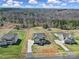 Wide aerial view of homes with large yards, set amidst lush greenery and mature trees, in a serene neighborhood setting at 2167 Whispering Winds Dr, Rock Hill, SC 29732