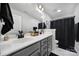 Modern bathroom featuring a dual sink vanity with granite counters and a framed mirror at 2167 Whispering Winds Dr, Rock Hill, SC 29732