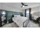 Stylish bedroom featuring a dark accent wall, modern ceiling fan and decorative furniture at 2167 Whispering Winds Dr, Rock Hill, SC 29732