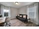 Cozy office space featuring a comfortable futon, light wood floors, and natural light at 2167 Whispering Winds Dr, Rock Hill, SC 29732