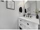 Stylish powder room featuring a marble countertop, black fixtures, and elegant decorative accents at 2167 Whispering Winds Dr, Rock Hill, SC 29732