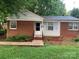 Charming single-story brick home with a well-maintained front yard and inviting entrance at 2508 Druid Hills Way, Charlotte, NC 28206