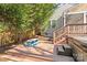 Backyard deck featuring a picnic table and hot tub, perfect for outdoor enjoyment at 2606 Chesterfield Ave, Charlotte, NC 28205