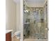 Bathroom featuring a custom tiled shower with glass door, toilet, and vanity at 2606 Chesterfield Ave, Charlotte, NC 28205