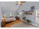 Bright bedroom features hardwood floors, vaulted ceiling, and a built-in desk with shelving at 2606 Chesterfield Ave, Charlotte, NC 28205