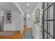 Bright foyer featuring hardwood floors, built-in cabinets, and an elegant mirror at 2606 Chesterfield Ave, Charlotte, NC 28205