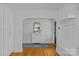 Bright foyer featuring hardwood floors, built-in cabinets, and an elegant mirror at 2606 Chesterfield Ave, Charlotte, NC 28205