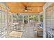 Relaxing screened-in porch with dining and seating areas, and beautiful views of the surrounding landscape at 2606 Chesterfield Ave, Charlotte, NC 28205