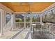 Well lit porch with dining and seating areas overlooking the surrounding landscape at 2606 Chesterfield Ave, Charlotte, NC 28205