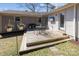 Backyard with a wooden deck, outdoor seating, hanging flower baskets, and a grill at 2727 Hilliard Dr, Charlotte, NC 28205