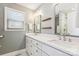 Bright bathroom with a double vanity, modern fixtures, and a window with natural light at 2727 Hilliard Dr, Charlotte, NC 28205