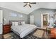 Bright bedroom with a vaulted ceiling, a bed with white linens, and a ceiling fan at 2727 Hilliard Dr, Charlotte, NC 28205
