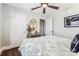 Bedroom with a patterned bedspread, dark wood floors, and a decorative mirror over a dresser at 2727 Hilliard Dr, Charlotte, NC 28205