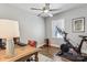 Bedroom with a ceiling fan, desk, and exercise bike, perfect for a home office or workout space at 2727 Hilliard Dr, Charlotte, NC 28205