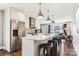 Modern kitchen with stainless steel appliances, a center island with stools, and white cabinets at 2727 Hilliard Dr, Charlotte, NC 28205