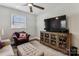 Cozy living room featuring a plush chair, television, and modern cabinet at 2727 Hilliard Dr, Charlotte, NC 28205