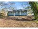 Well sized backyard featuring mature trees and natural surroundings offering a peaceful retreat at 3030 Crawford Ave, Gastonia, NC 28052