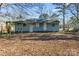 Cozy backyard featuring a rustic pergola, level ground, and natural surroundings offering a peaceful retreat at 3030 Crawford Ave, Gastonia, NC 28052