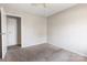 A cozy bedroom featuring neutral walls and carpet at 3030 Crawford Ave, Gastonia, NC 28052